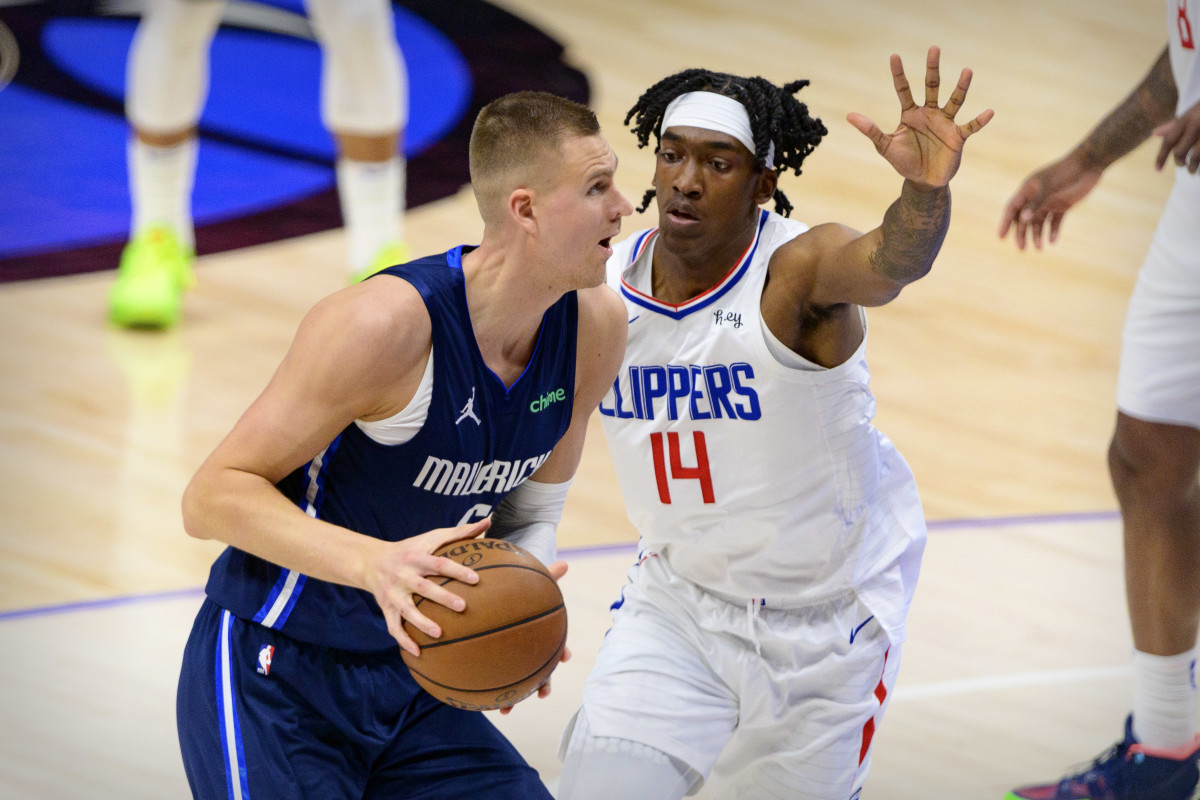 Mavs’ Kristaps Porzingis goes up for a shot against Clippers’ Terance Mann.